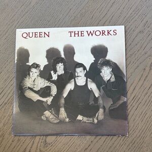 Que 'The Works' Album Cover with Black and White Theme